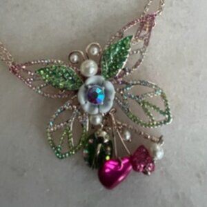 Betsy Johnson rose tone necklace and butterfly pendant